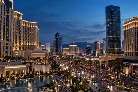 AI illustration: city avenue and hotels at dusk